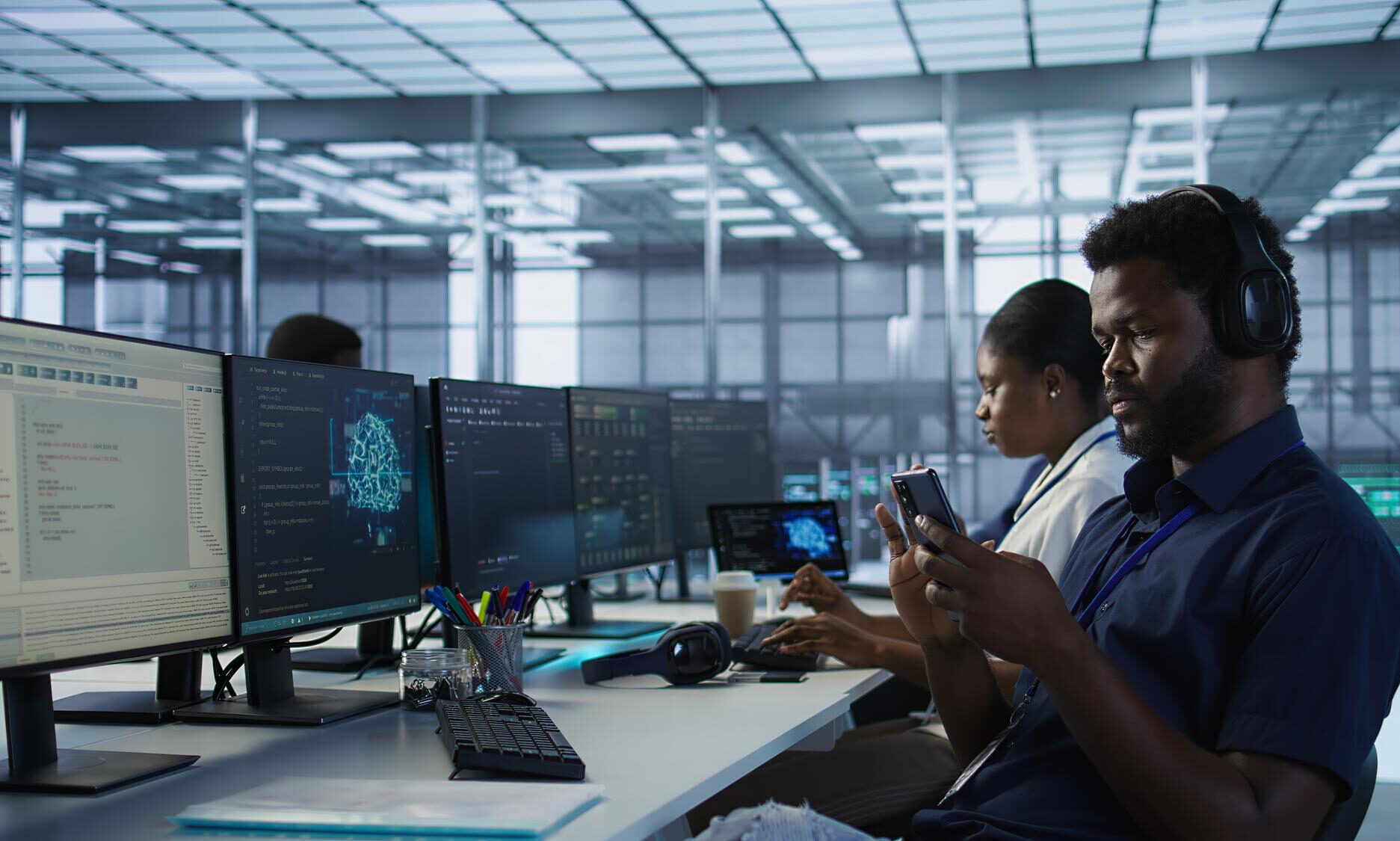 Web developer coding responsive website on screen