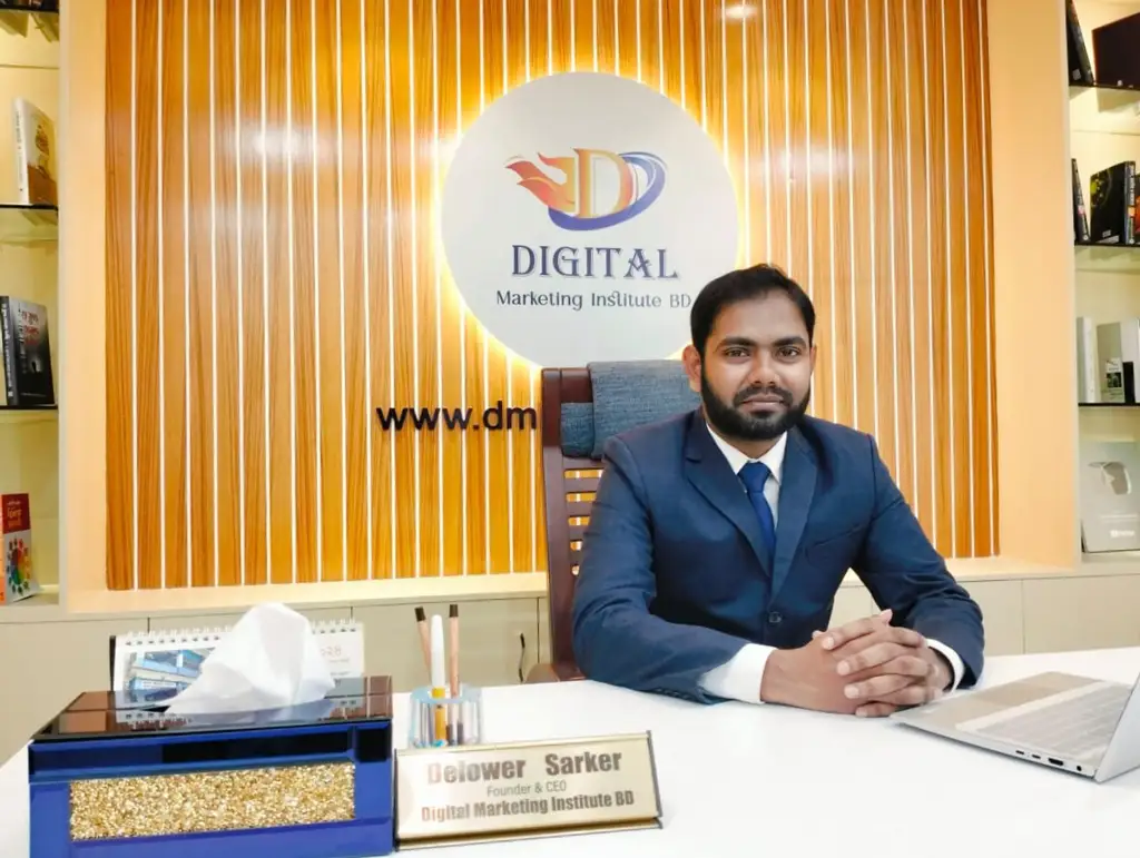 Photo of Delowar Sarkar, Founder & CEO of Digital Marketing Institute BD, sitting at a desk in a professional office setting.